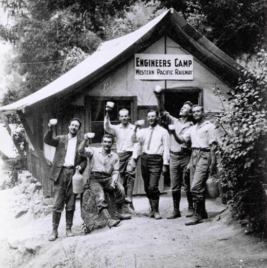 Engineers holding cups up at the Engineers Camp